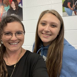 A selfie of a site coordinator and student smiling named Lexi and Ali