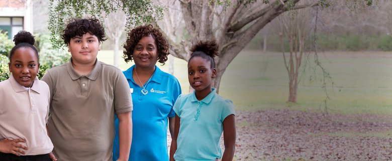 CIS Site Coordinator and 3 Students
