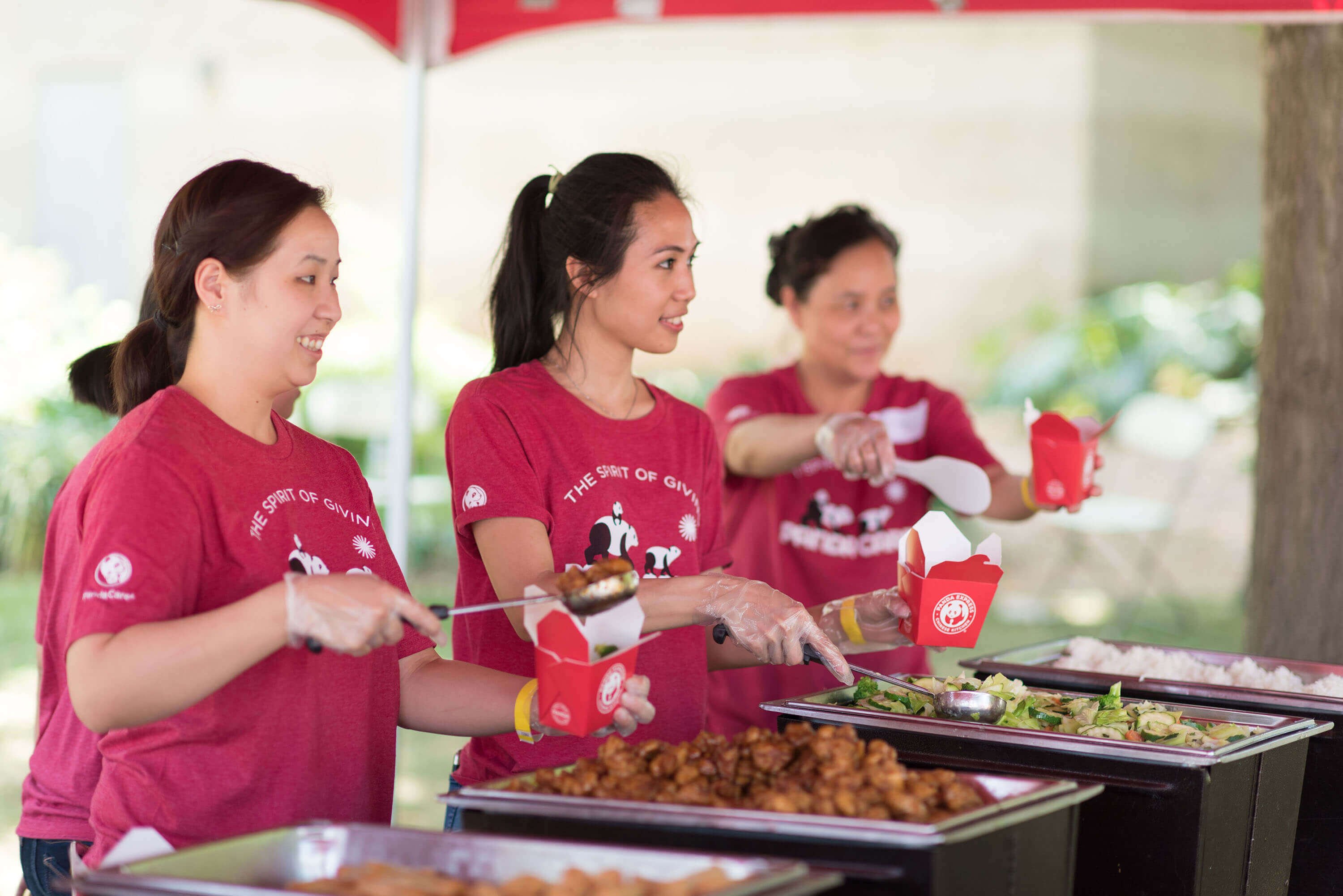 Panda Express members serving food