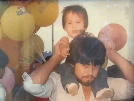 Rey Saldaña (as a child) and his dad