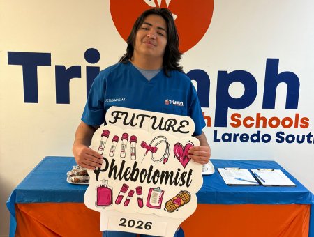 CIS student holding a sign that says future phlebotomist 2026