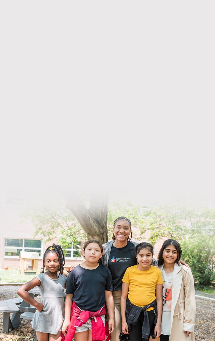 Student with globe and stack of books